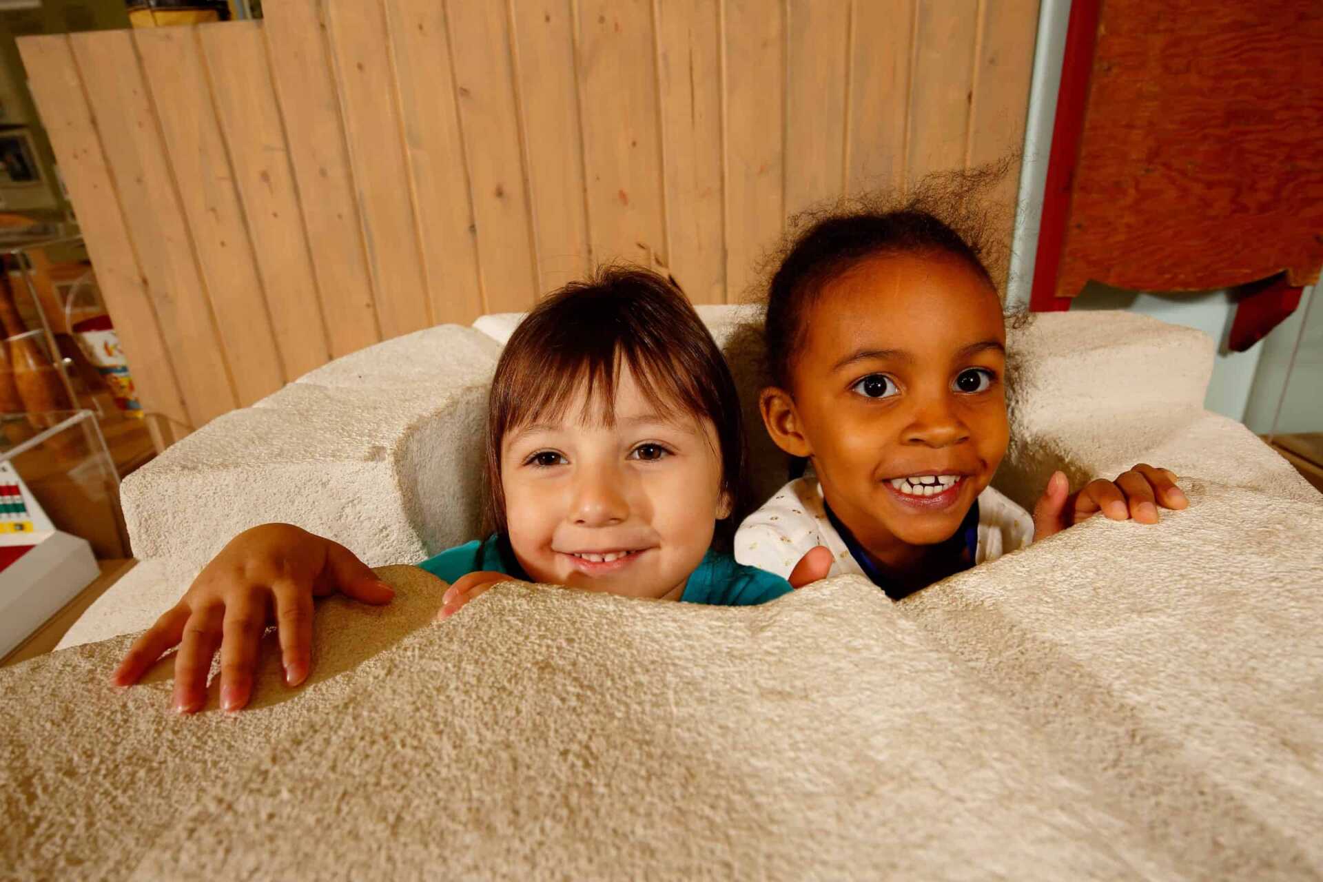 Children looking out the top of an igloo in Yorkton.