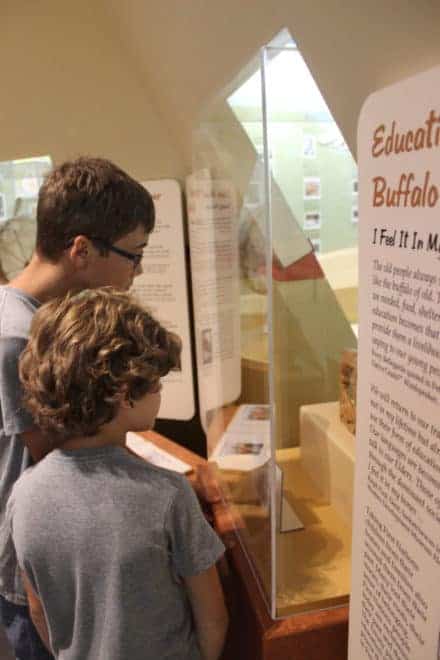 Two students explore the weather exhibit