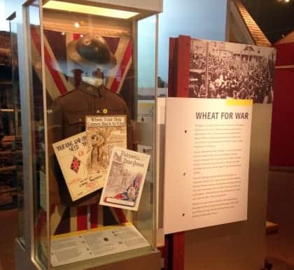 Showcase of World War 1 artifacts, including a uniform and helment