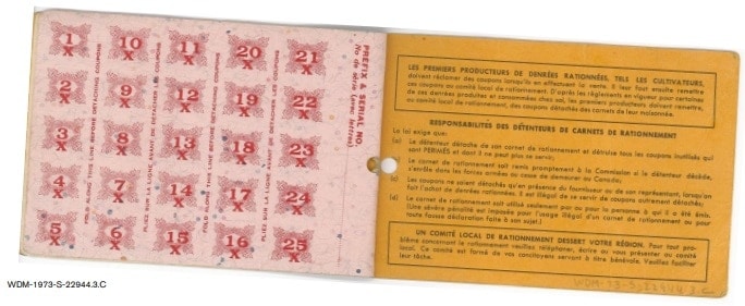 World War II ration book 6, open to inside pages showing ration coupons and listing book holders' responsibilities