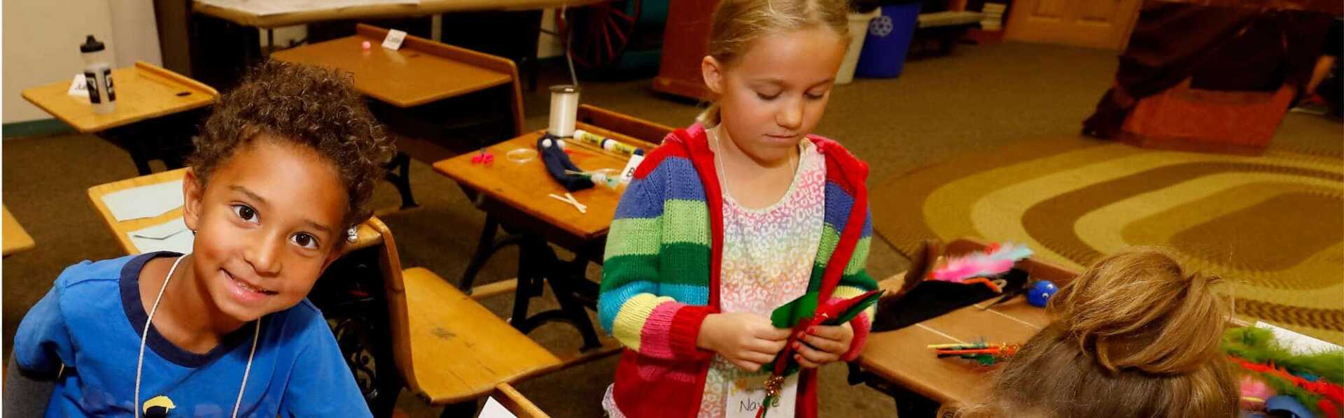 A picture of two children enjoying activities at the WDM Saskatoon.