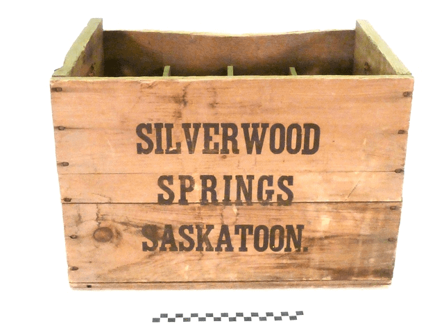 Wooden crate with the words "Silver Springs Saskatoon." painted on the front